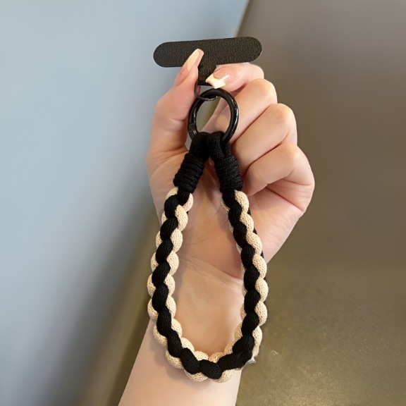 Kézzel készített telefontartó zsinór nylon fonallal, fém csattal és gumiból készült medállal állat formában