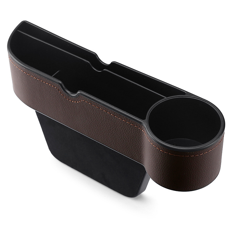 Glabāšanas kaste vietā starp sēdekļiem – āda, ūdensnecaurlaidīga, izturīga pret spiedienu, pakarināms uzstādījums