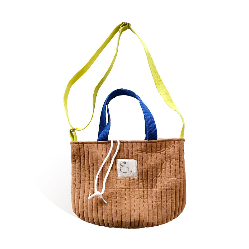 Ženska platnena crossbody torba, mala okrugla quiltirana torba s šnimom za zatvaranje i džepom za telefon