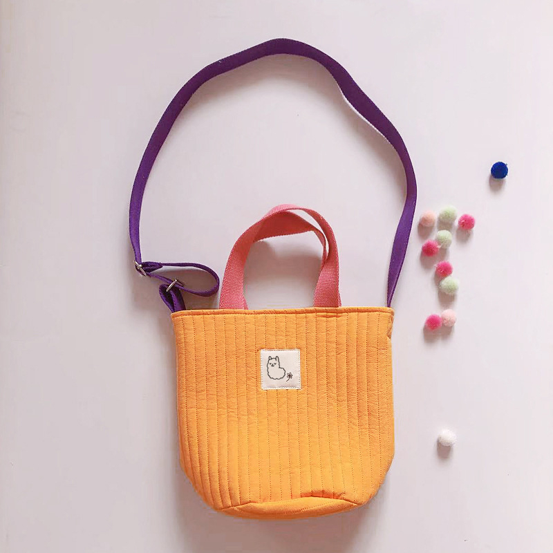 Ženska platnena crossbody torba, mala okrugla quiltirana torba s šnimom za zatvaranje i džepom za telefon