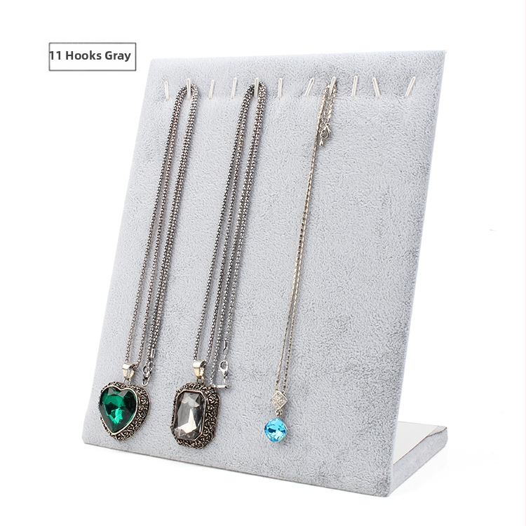 Stolný výstavný stojan na šperky: stojan na náušnice, náhrdelníky a náramky, z hustej dosky s flanelovým krytím, tvaru L, jednovrstvový, umelecký štýl