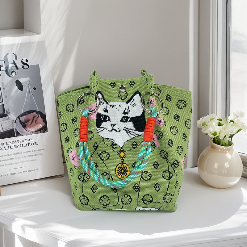 Moteriška megzta ovali cilindrinė rankinė bucket (Poliesteris; cilindrinė forma; magnetinis užsegimas; pamušalas poliesteris)