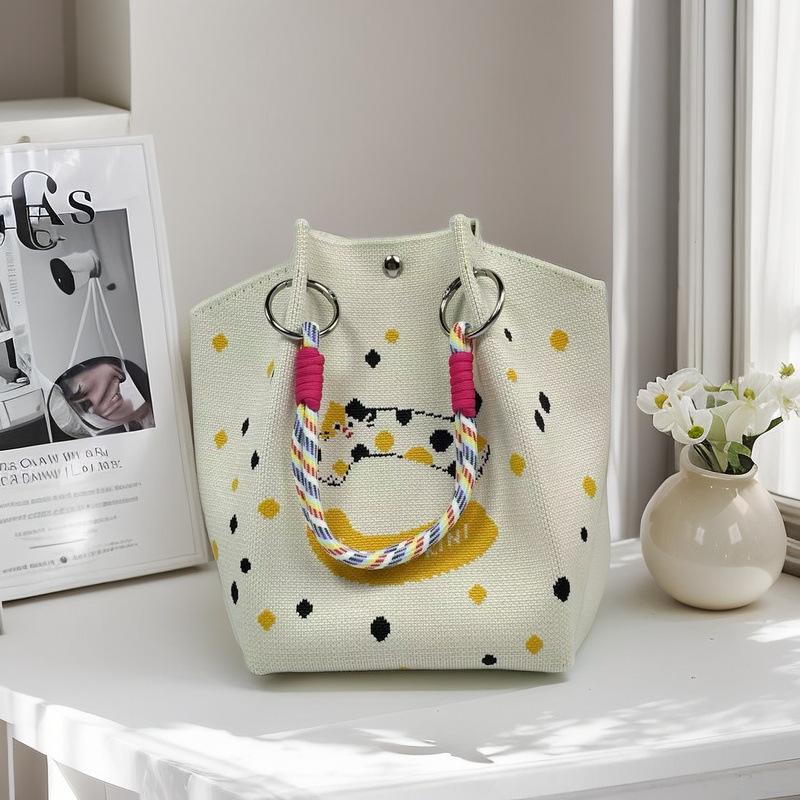 Moteriška megzta ovali cilindrinė rankinė bucket (Poliesteris; cilindrinė forma; magnetinis užsegimas; pamušalas poliesteris)