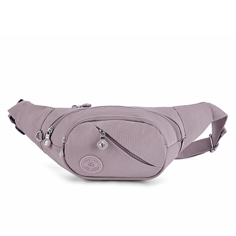 Hibridinė krūtinės/juosmens rankinė telefonui — išorė nailonas, vidus medvilnė, užtrauktukas, vidinės kišenės telefonui ir dokumentams