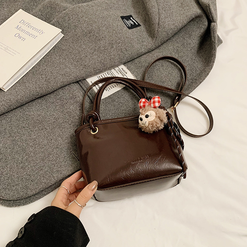 Bucket torba, PU materijal, gradski stil, crossbody dizajn, zatvarač, poliester podstava, unutarnji džep za mobitel