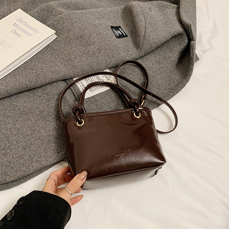 Bucket torba, PU materijal, gradski stil, crossbody dizajn, zatvarač, poliester podstava, unutarnji džep za mobitel