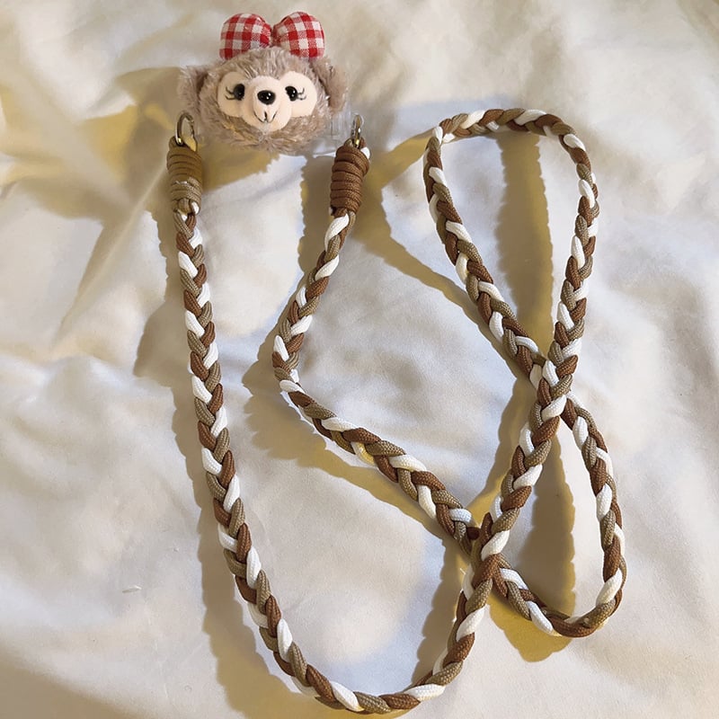 Pamia pútko na mobilný telefón — dámsky štýl, nylonové šnúry, plastová spona, zadný klip, krížový dizajn