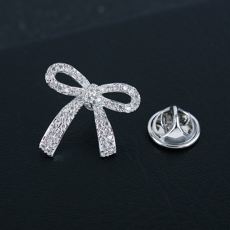 Rézből készült brooch cirkóniával, masni motívum, hópehely, mikroinlay