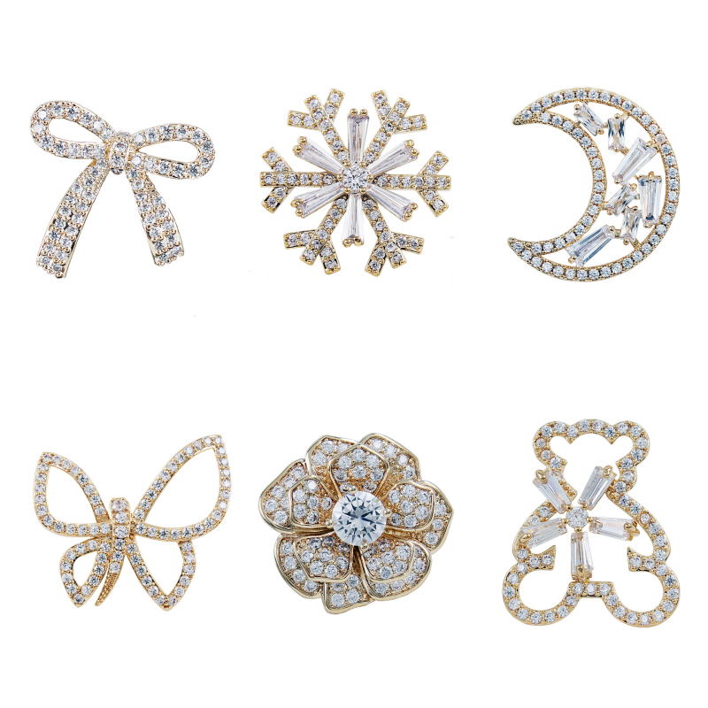 Rézből készült brooch cirkóniával, masni motívum, hópehely, mikroinlay