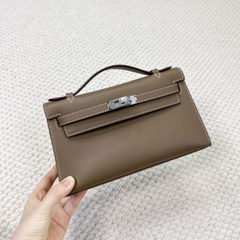Geantă Kelly, stil urban minimalist, piele Swift top-grain autentică (din primul strat de piele de vacă), închidere cu lacăt, curea crossbody cu o singură curea, buzunar pentru telefon și buzunar pentru ID