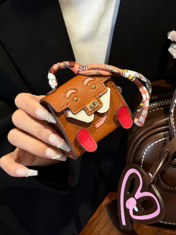 Ādas aizsargkārbiņa AirPods Pro 2 ar mini piekariņu karabīnei, karikatūru dizains, holster stils, daudzfunkcionāls, pārnēsājams; saderīgs ar Apple, OPPO, VIVO