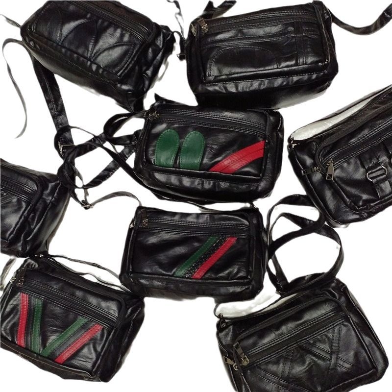 Női PU oldaltáska — vízszintes négyszög alak, cipzáras záródás, poliészter bélés, belső zsebek: cipzáras zseb, telefonzseb, személyi igazolvány zseb, kamera zseb