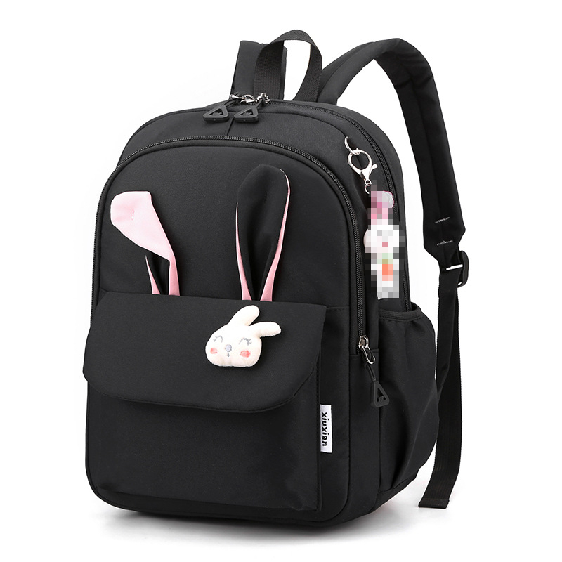 Mergaitėms skirta mokyklinė kuprinė iš nailono, vaikiško ir žaismingo stiliaus, skirta 1–2 klasei