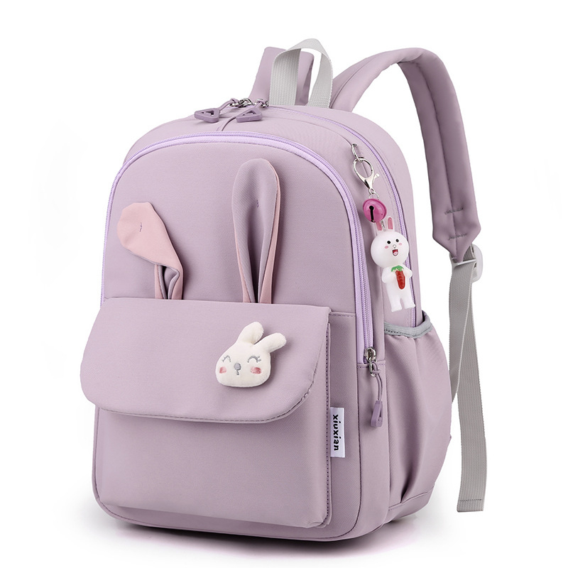 Mergaitėms skirta mokyklinė kuprinė iš nailono, vaikiško ir žaismingo stiliaus, skirta 1–2 klasei