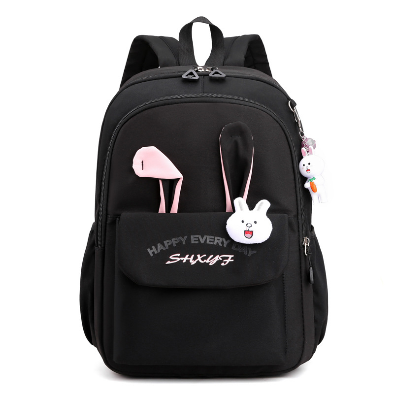 Mergaitėms skirta mokyklinė kuprinė iš nailono, vaikiško ir žaismingo stiliaus, skirta 1–2 klasei