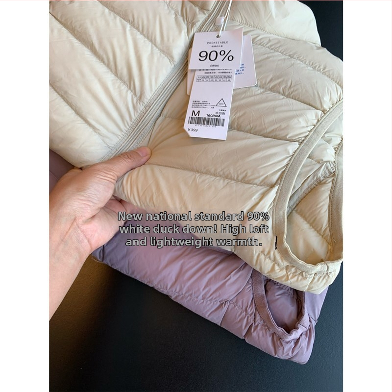 Nailona jaka ar plānu siluetu, 86–90% balta pīļu pūka, rāvējslēdzējs