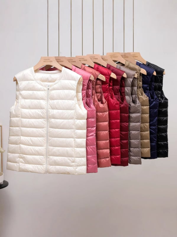 Női pehelyes mellény, 50% pehelytartalom, hossz 50–65 cm, cipzár