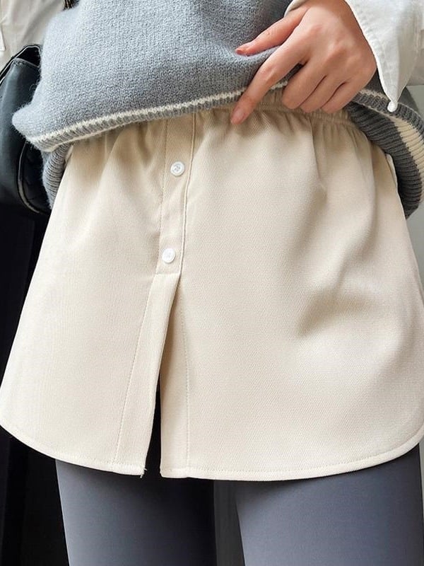 A-vonalú rövid szoknya, magas derék, poliészter anyag (80–90% a fő anyagból), kollázs varrás, mikroelasztikus