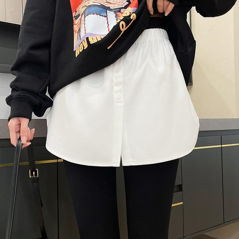 A-vonalú rövid szoknya, magas derék, poliészter anyag (80–90% a fő anyagból), kollázs varrás, mikroelasztikus