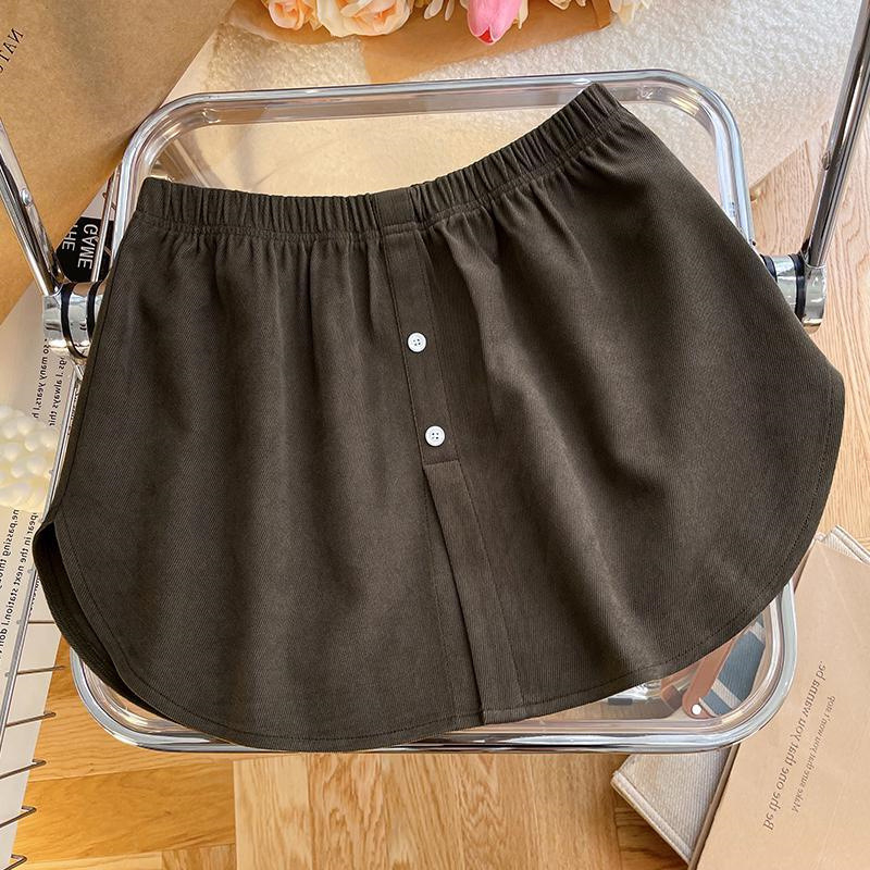 A linijos trumpas sijonas, vienos spalvos, poliesterio audinys, panelinis siuvimas, žiemos 2023