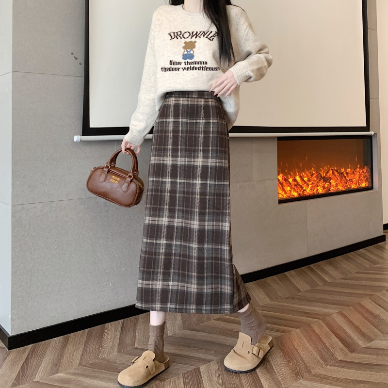 Ilgos vilnos sijonas su languotu raštu, platėjanti silueto linija, poliesterio-elastano mišinys (elastanas <30%), elastinga, ruduo 2025