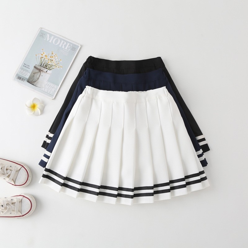 Fustă plisată pentru fete, talie înaltă, linie A, stil JK, dungată. Material: amestec poliester-bumbac; țesătura principală 88% poliester; căptușeală poliester 71–80%.