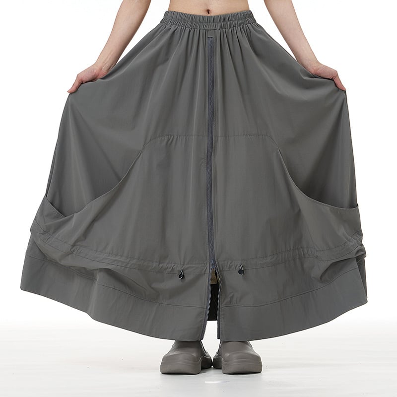 Japán-stílusú cipzár-applikációval ellátott A-vonalú midi szoknya, absztrakt mintával, pamut-nylon keverék, kollázs- vagy összevarrási kivitelezés, 2025 ősz