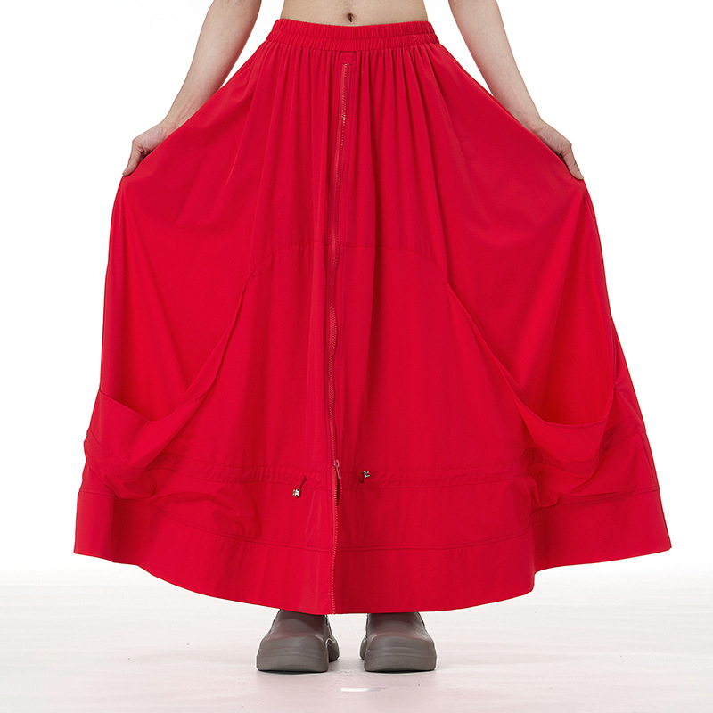 Japán-stílusú cipzár-applikációval ellátott A-vonalú midi szoknya, absztrakt mintával, pamut-nylon keverék, kollázs- vagy összevarrási kivitelezés, 2025 ősz