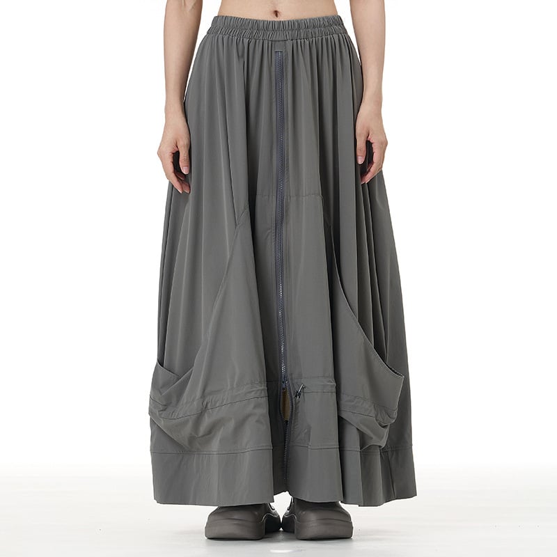 Japán-stílusú cipzár-applikációval ellátott A-vonalú midi szoknya, absztrakt mintával, pamut-nylon keverék, kollázs- vagy összevarrási kivitelezés, 2025 ősz