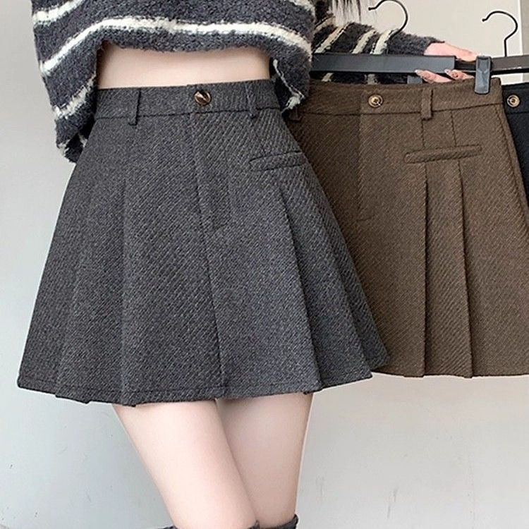 A linijos vilnonė klostuota trumpa sijonė, aukštas liemuo, be lyginimo, pavasaris 2025