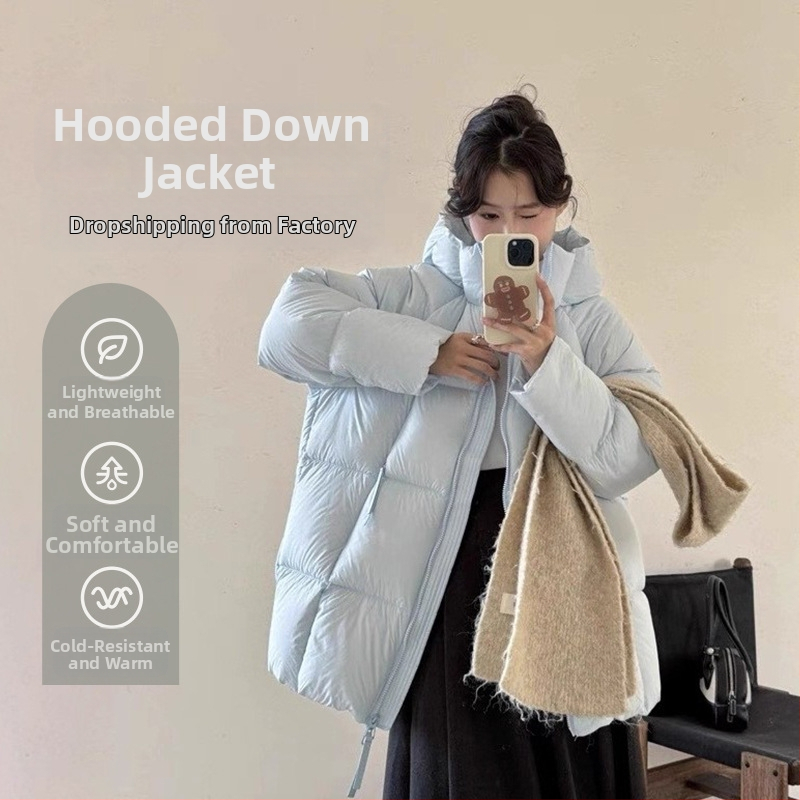 Dámska bunda s kapucňou, stredná dĺžka, výplň 201-300 g páperie, obsah páperia 91-95%, nadýchaný pocit
