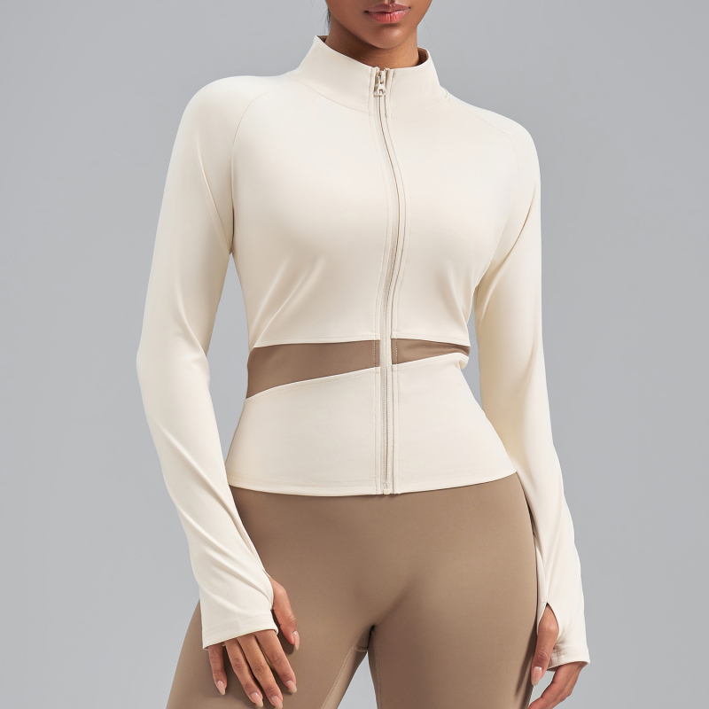 Sievietēm paredzēta persiku krāsu bloku jogas jaka ar augstu kaklu, elpojoša, atklāj vēderu, garas piedurknes, poliestera audums 82,5% — Vasara 2025