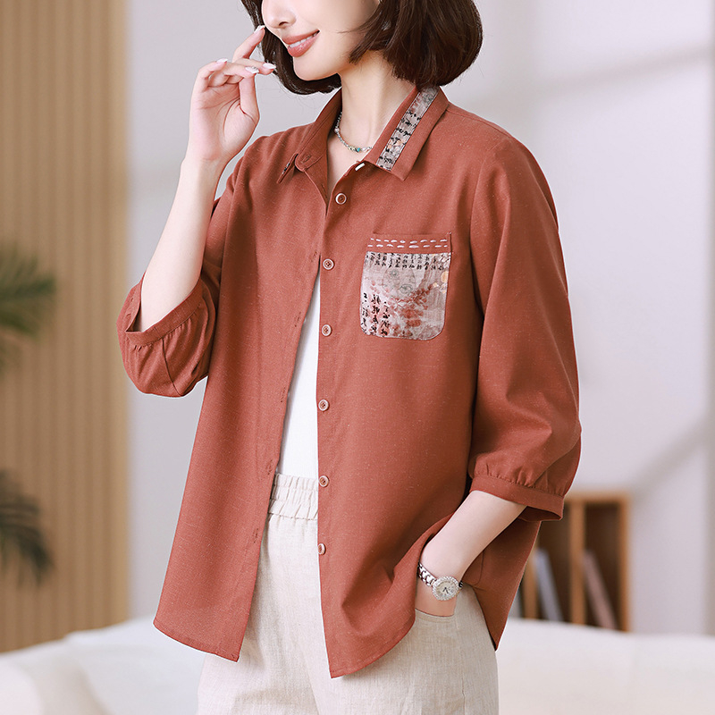 Женска риза от полиестер 80–90% и коноп (<30%), свободна кройка, ръкав 7/8, яка с ревера, дължина 50–65 см