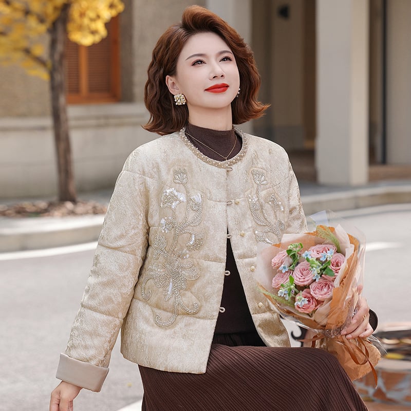 Jachetă scurtă de iarnă pentru femei, material principal poliester 95%+, umplutură din imitatie de mătase-cotton, glugă, model abstract, lungime medie 50–65 cm.