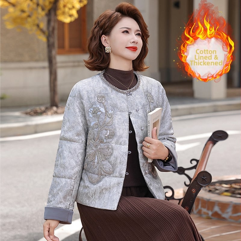 Jachetă scurtă de iarnă pentru femei, material principal poliester 95%+, umplutură din imitatie de mătase-cotton, glugă, model abstract, lungime medie 50–65 cm.