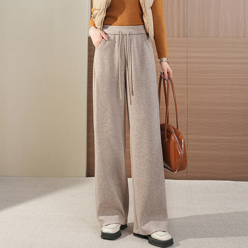 Toamnă 2025: pantaloni largi de tip mamă, talie înaltă și croială harém, material imitație de lână (poliester 50–70%, fibre de bambus 30–50%), elasticitate micro-bounce