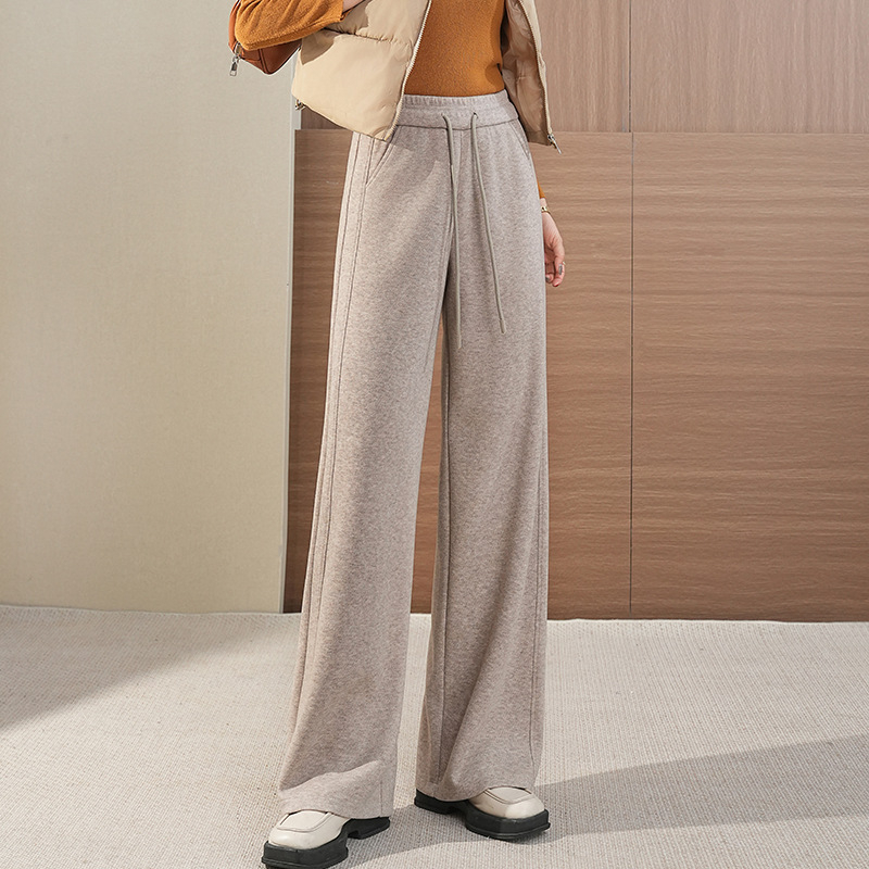 Toamnă 2025: pantaloni largi de tip mamă, talie înaltă și croială harém, material imitație de lână (poliester 50–70%, fibre de bambus 30–50%), elasticitate micro-bounce