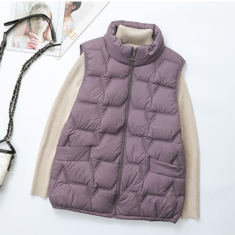 Női pehely-pamut mellény, szabályos szabású, polo gallér, cipzár, hossz 50–65 cm, 2025 tavasz kiadás