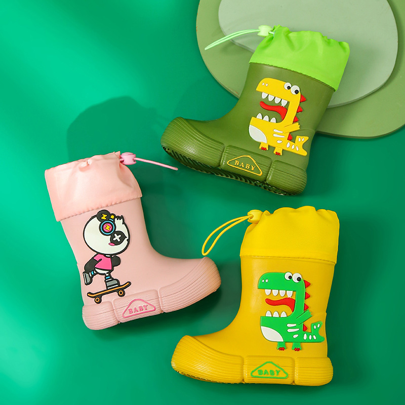 Gyerekeknek esőcsizma - EVA felsőrész, középső csőmagasság, lapos sarok, rajzfilm dinoszaurusz mintával, uniszex
