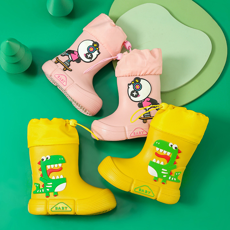 Gyerekeknek esőcsizma - EVA felsőrész, középső csőmagasság, lapos sarok, rajzfilm dinoszaurusz mintával, uniszex