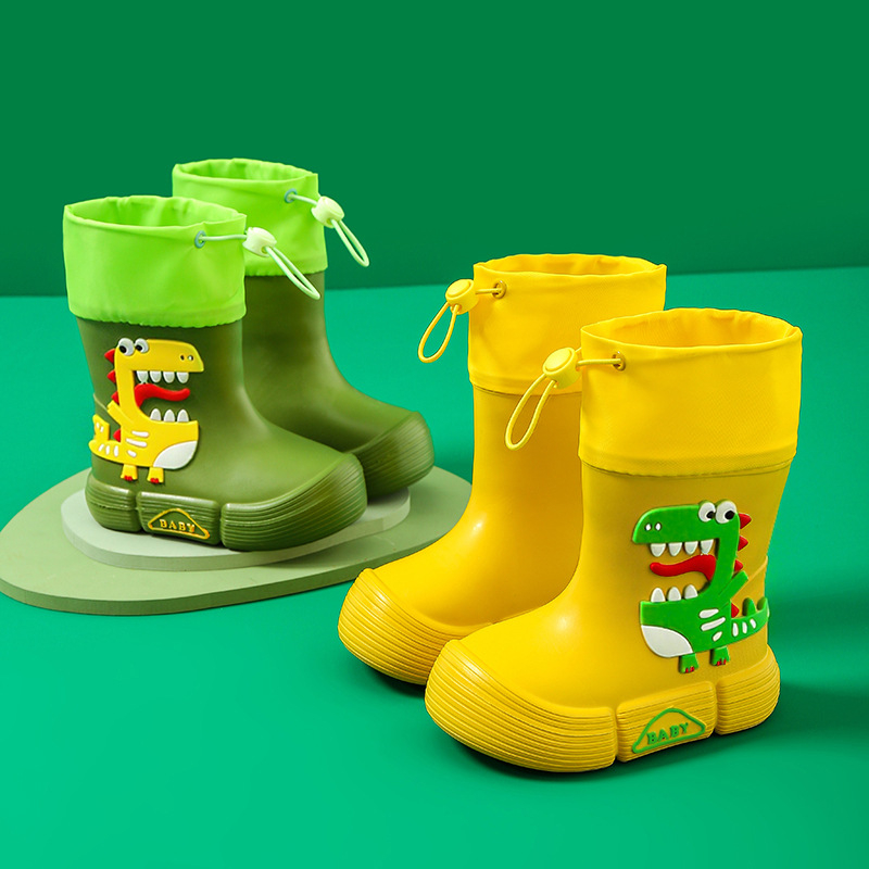 Gyerekeknek esőcsizma - EVA felsőrész, középső csőmagasság, lapos sarok, rajzfilm dinoszaurusz mintával, uniszex