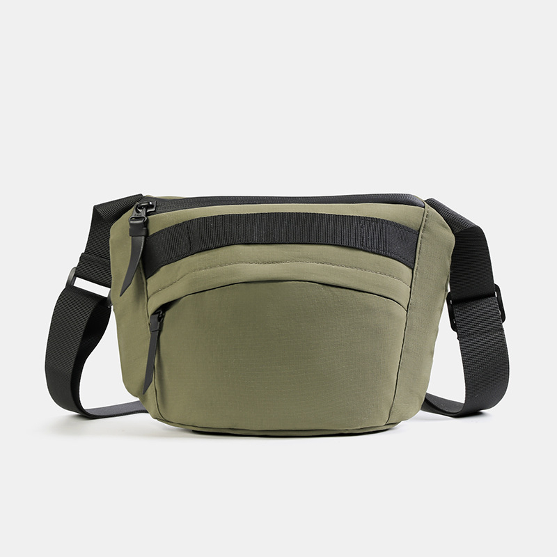 Unisex najlon crossbody torba sa zatvaračem, ovalni oblik, jednoručna naramenica, džep za telefon i dokumente.