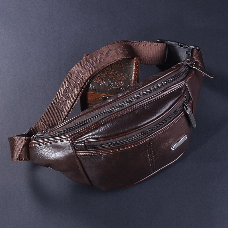 Férfi övtáska természetes bőrből, hold alakú, zipzárral záródó; belső rekeszek: zipzáras zseb, telefonzseb, identifikációs zseb, poliészter bélés