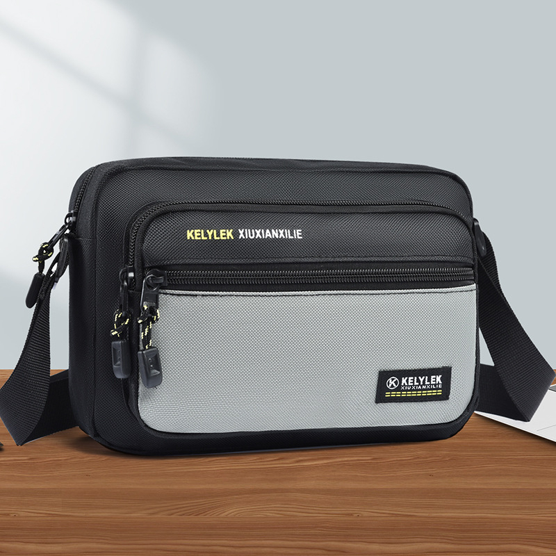 Muška crossbody torba, gradski minimalistički stil, Oxford tkanina, vodootporna, ultra lagana, proljeće 2025
