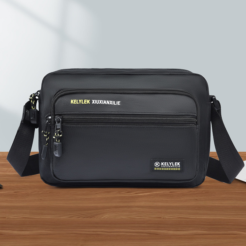 Muška crossbody torba, gradski minimalistički stil, Oxford tkanina, vodootporna, ultra lagana, proljeće 2025