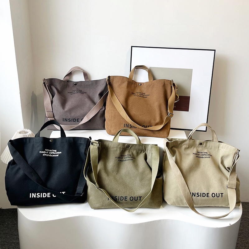 Muška platnena crossbody torba s proširenjem, tisk s slovima, platnena podstava, kod 107a, ljeto 2025