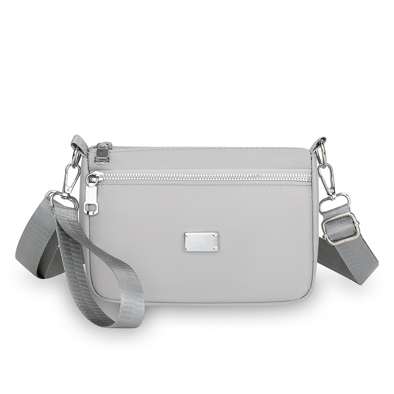 Nylon crossbody torba, gradski minimalistički stil, horizontalni kvadratni oblik, zatvarač, unutarnja džep s zatvaračem
