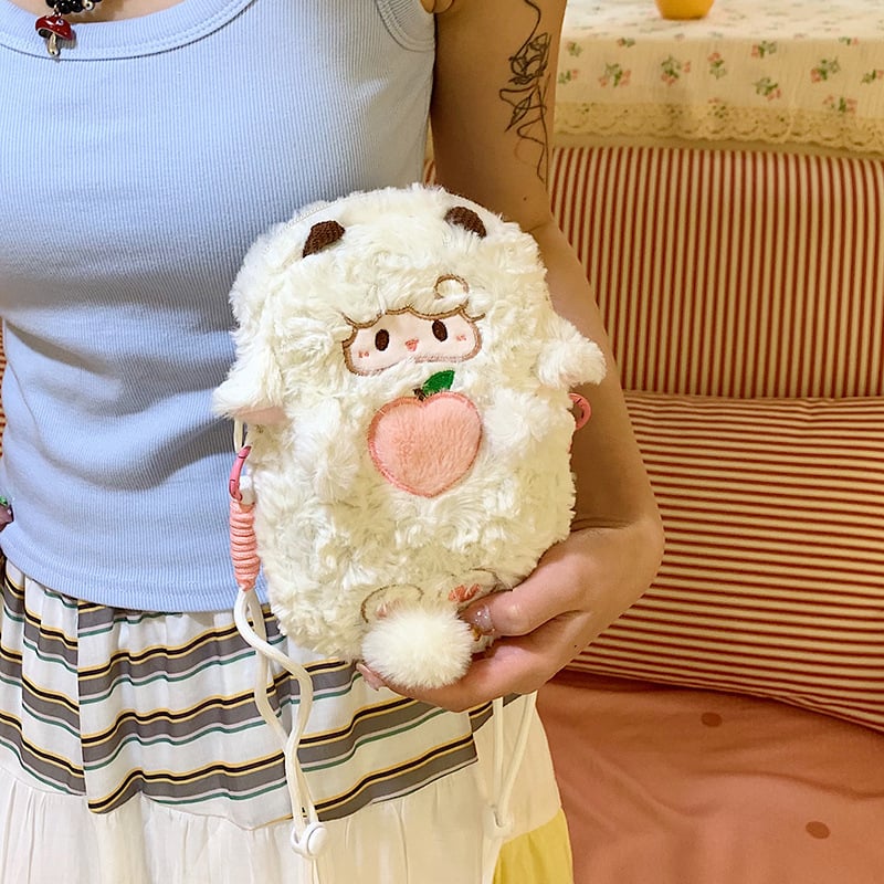Crossbody torba od veluru, cilindričnog oblika, zatvarač s poklopcem, unutarnja pregrada za mobitel