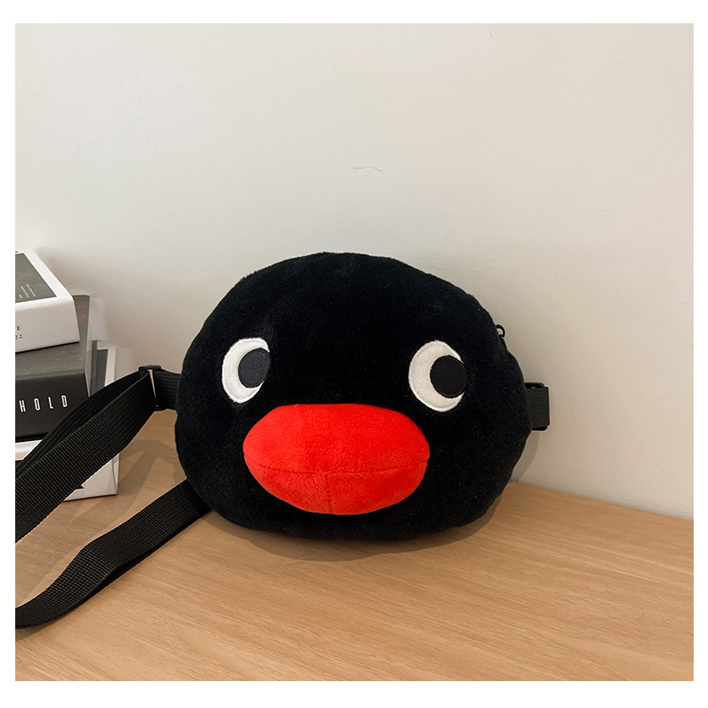 Crossbody torba od pliša, okruglog oblika, zatvarač na zip, pretinac za mobitel, podstava od poliester