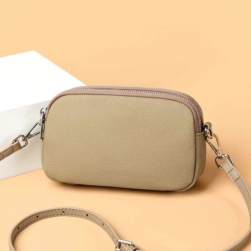 Ženska kožna crossbody torbica, mala kvadratna forma, zatvarač, džep za telefon i novčanik